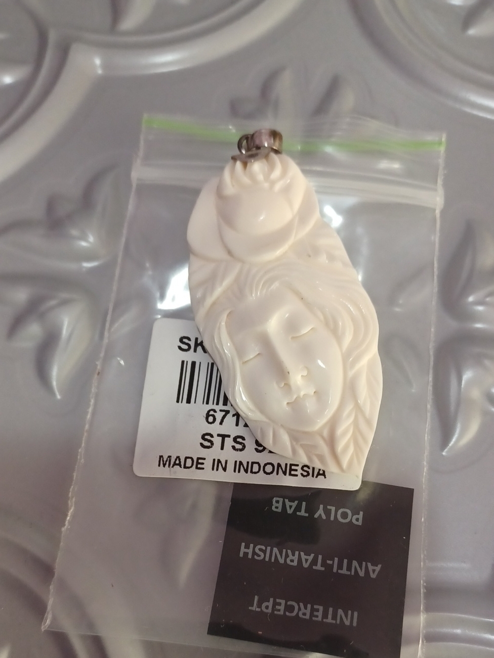 Carved White Goddess Face Pendant